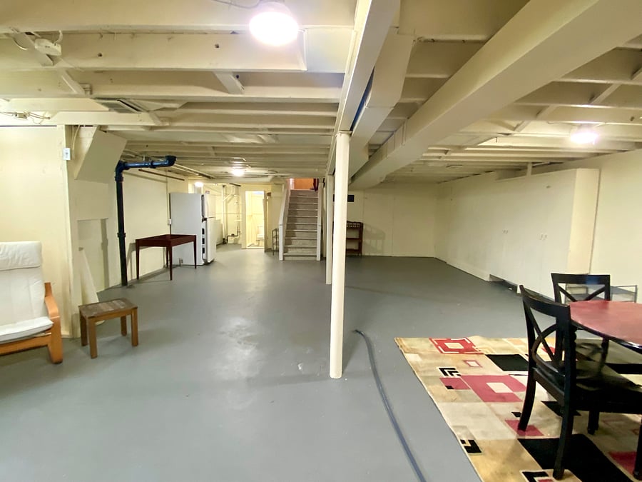 Large bright basement with smart tv, tables for doing puzzles, reading/ lounge chair, and lots of workout space. Built in cabinets for storage. Utility (furnace and water heater) area has workbench for someone who wants to do some crafting.