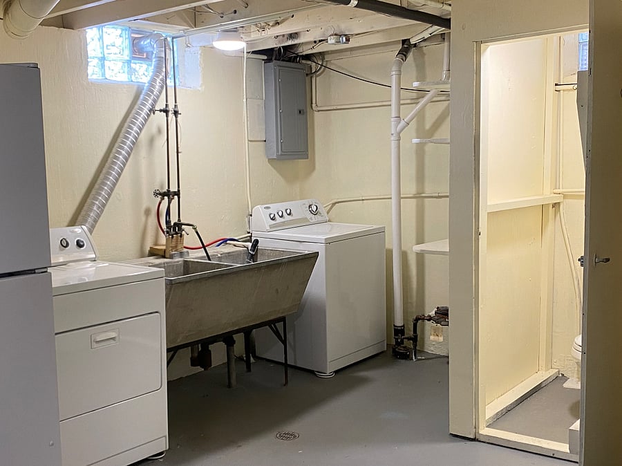 Full washer and dryer. Washtub. Laundry chute. Area to hang clothes and full ironing board. Extra refrigerator available for use by request. Half bathroom.