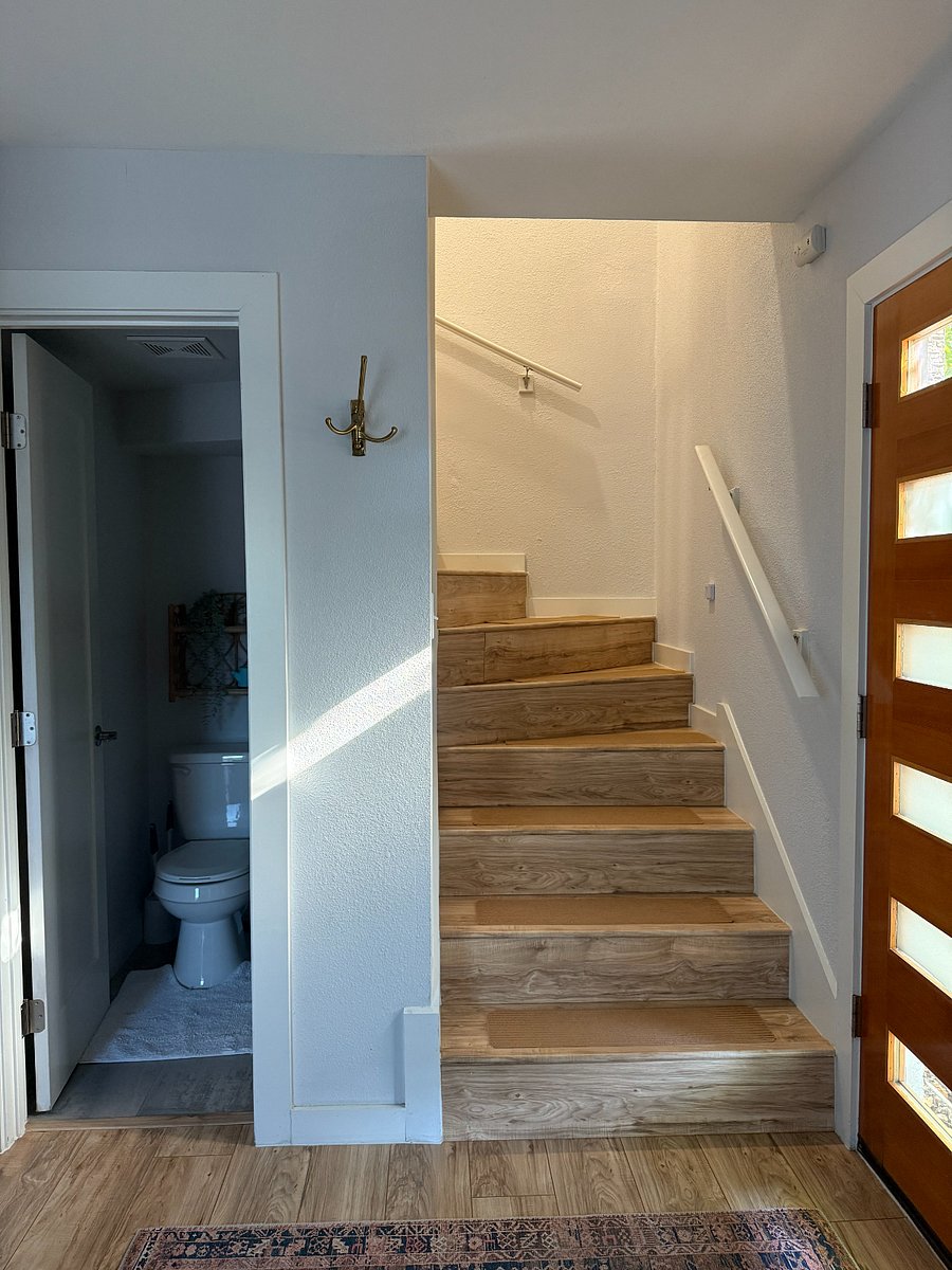 Half bath is under the staircase.