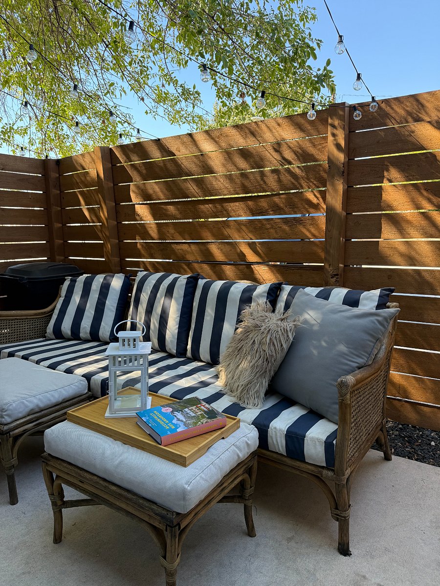 Outdoor patio with a comfy couch.