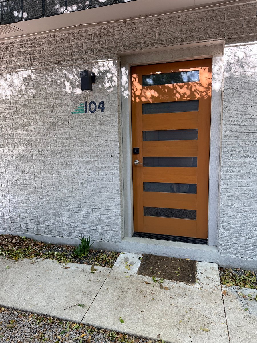 Modern front door with privacy glass to let light in, but not peeping eyes.