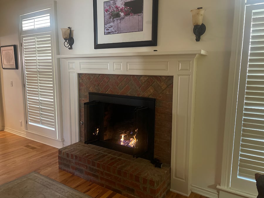 Fireplace room adjacent to kitchen.