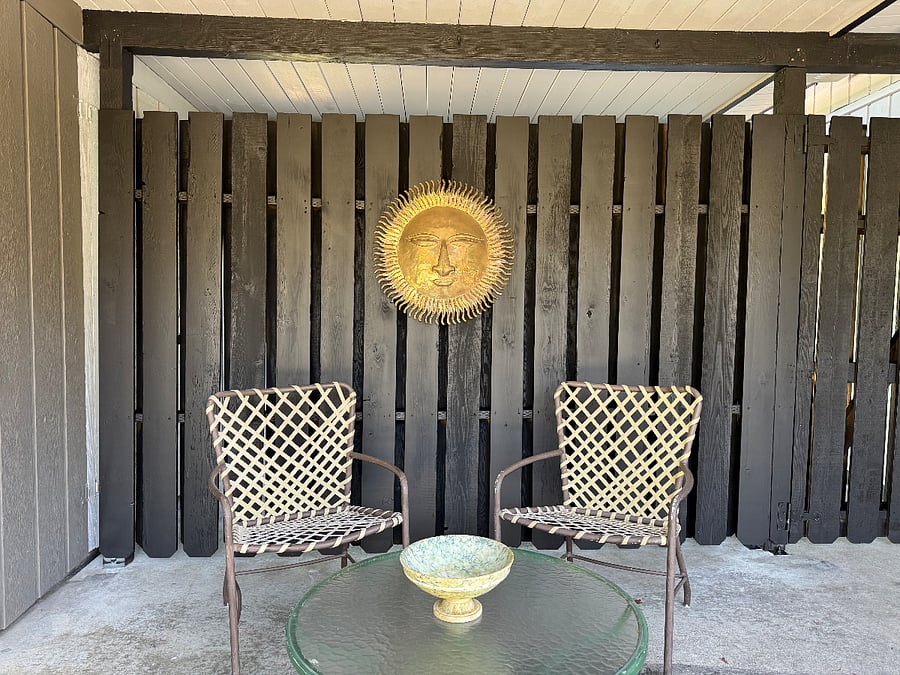 Covered sitting area in backyard
