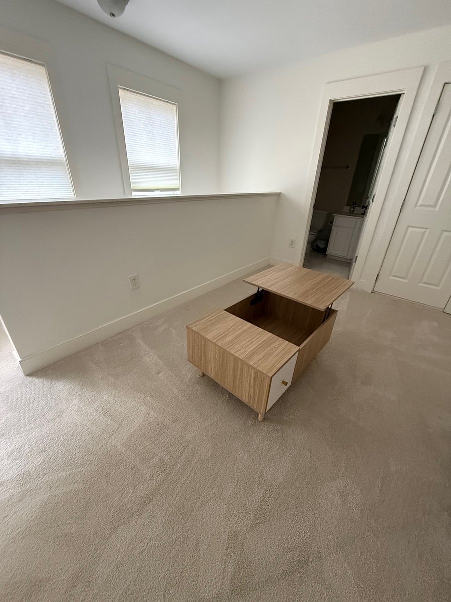 Suite living space. Coffee table has lifting top with storage. New sofa on its way for this space
