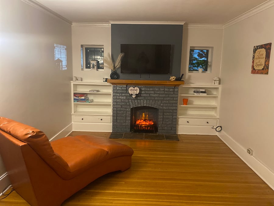 Living room with electric fireplace & smart tv