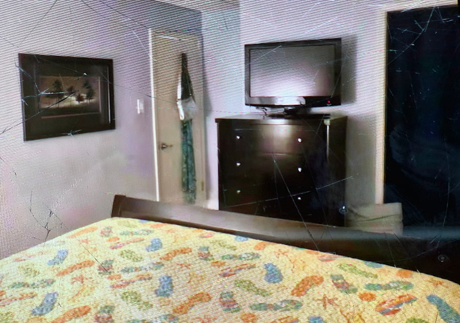 Master ensuit with a king size bed TV ceiling fan and blackout shades.