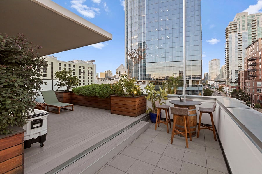 Roof deck flag bar looks onto Gallagher Square and Petco Park.
