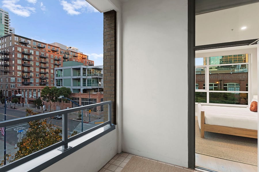 2nd floor primary bedroom private balcony overlooks J St.