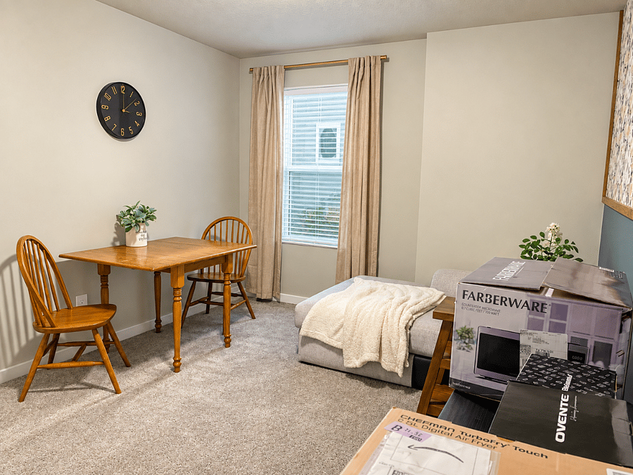 separate living and dining area with solid wood table that doubles as comfortable workspace,plus a cozy lounge area for relaxing