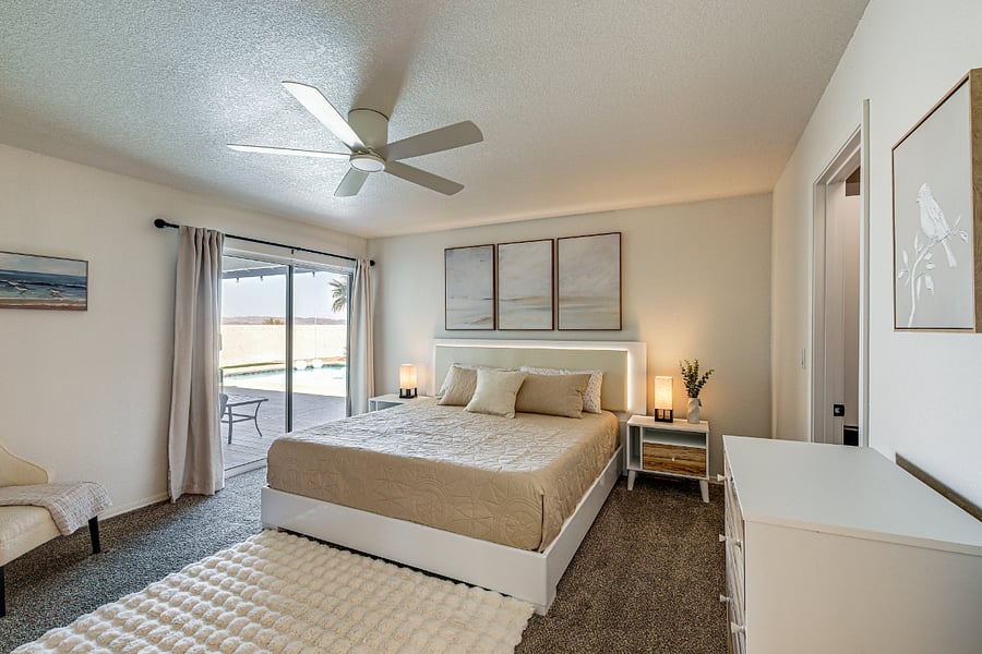 Master bedroom w/ sliding door to pool.