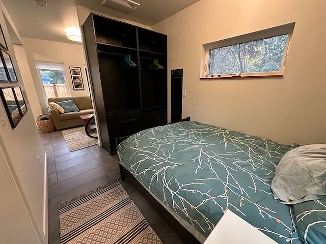 View from bedroom to living room with open closet