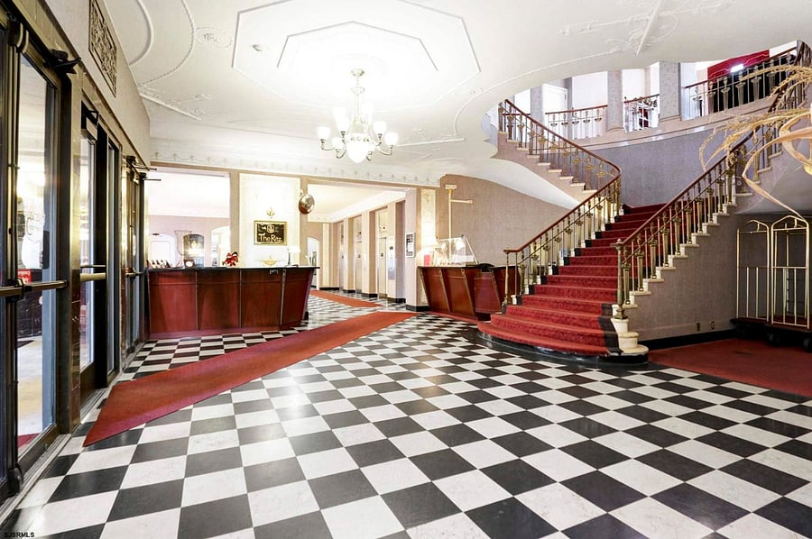 There is a second entrance to the building on the side.  This highlights the grand staircase and original black and white marble floor.