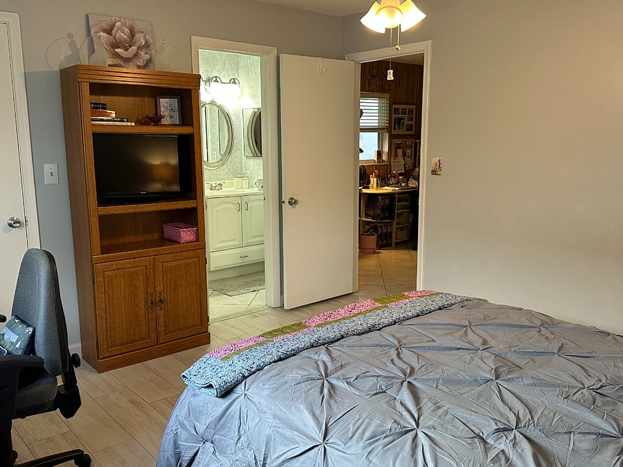 Bedroom, with en-suite bath. Large closet to the left of TV