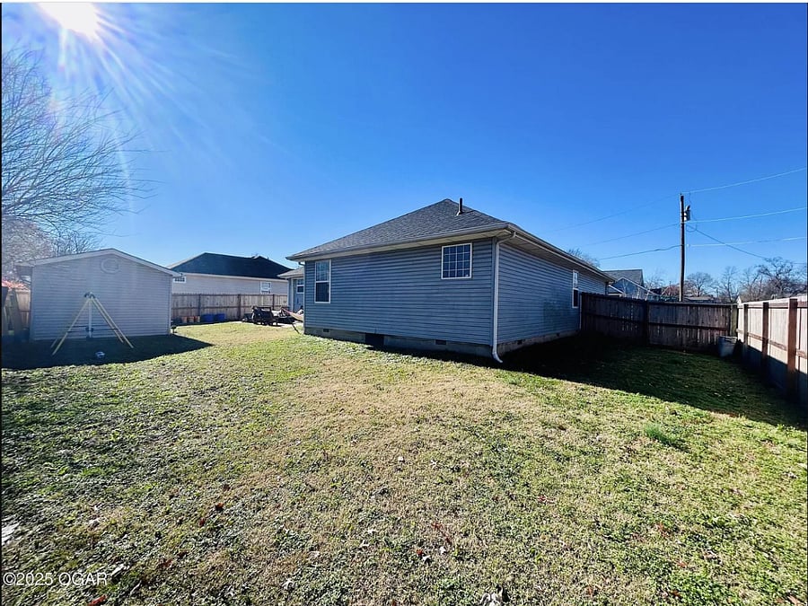 Spacious fully fenced (privacy) backyard with large storage shed
