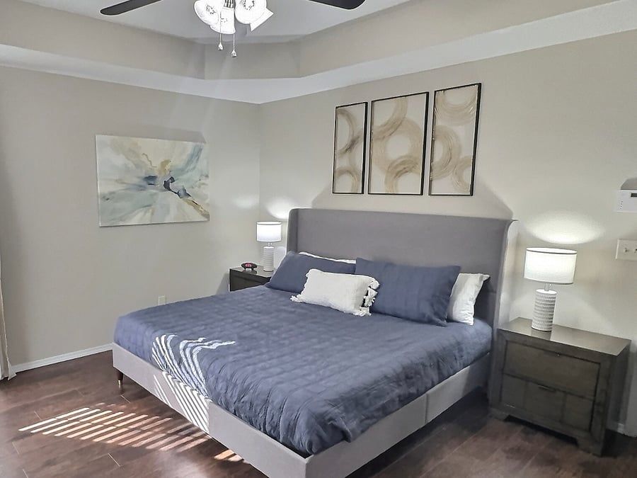 Bedroom 1 with king bed and 55" Smart TV, large walk-in closet