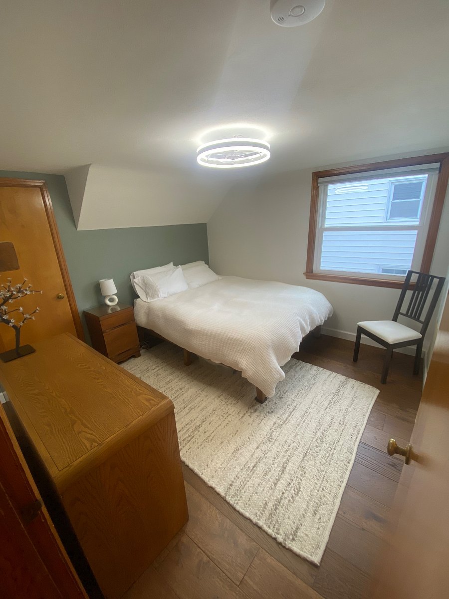 Freshly updated with new flooring and LED ceiling light with low-profile fan, plus blackout cellular shades.