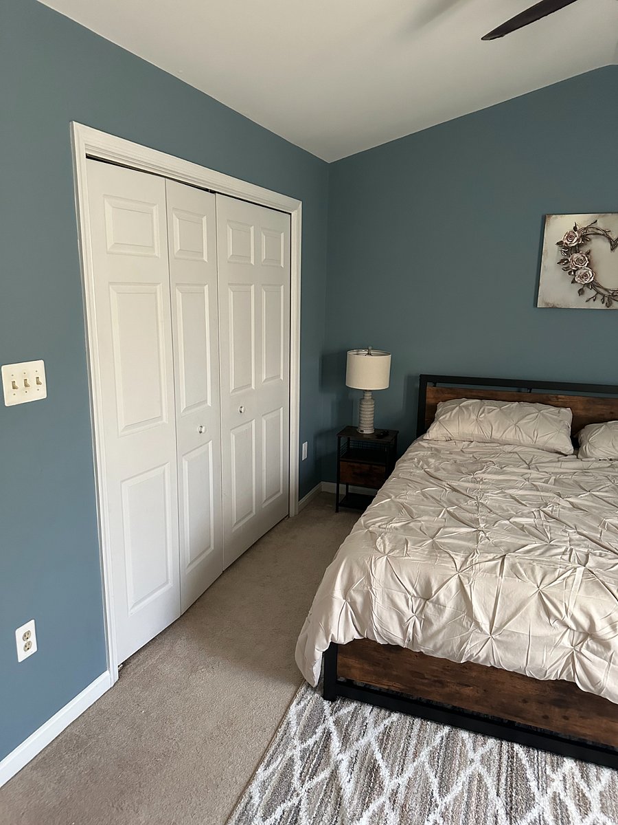 MBR with closet with custom built shelving and bars to maximize space and clothe capacity