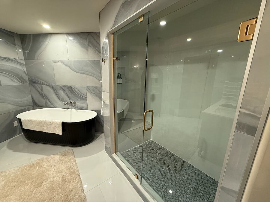 En suite master bath with large custom shower.