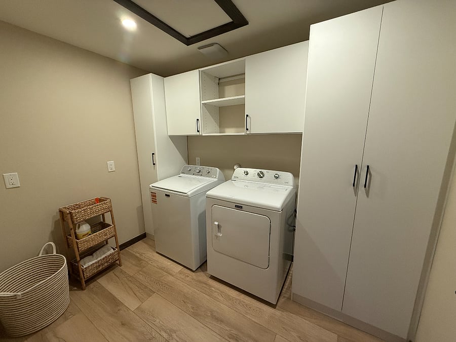 Large laundry room with new washer and dryer.