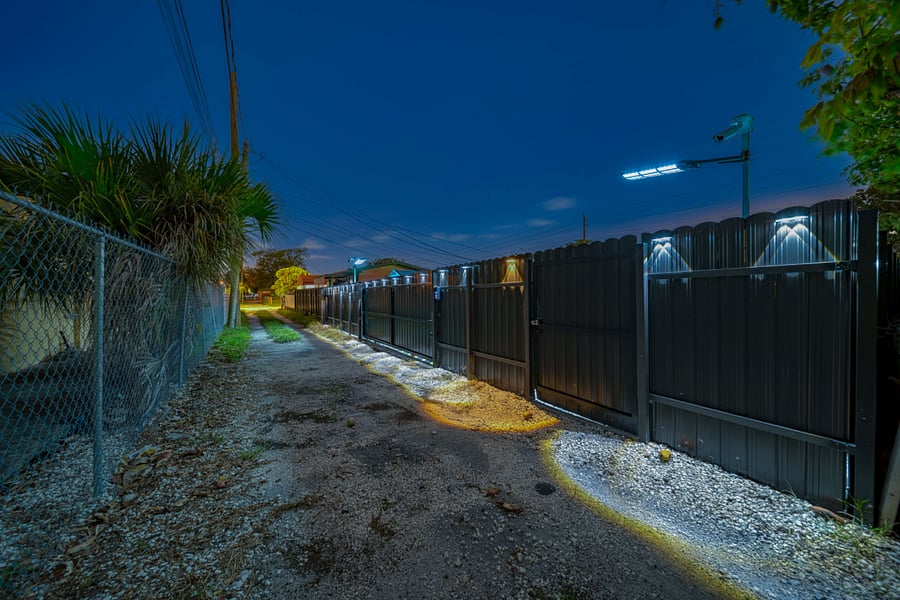 Night View of Parking Entrance w Remote Control Sliding Gate - Driving from the North heading South
