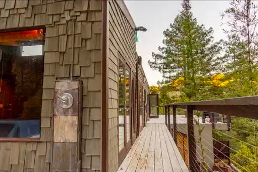 Two outdoor showers for sunshine showers. Updated railings and painted deck not depicted here.