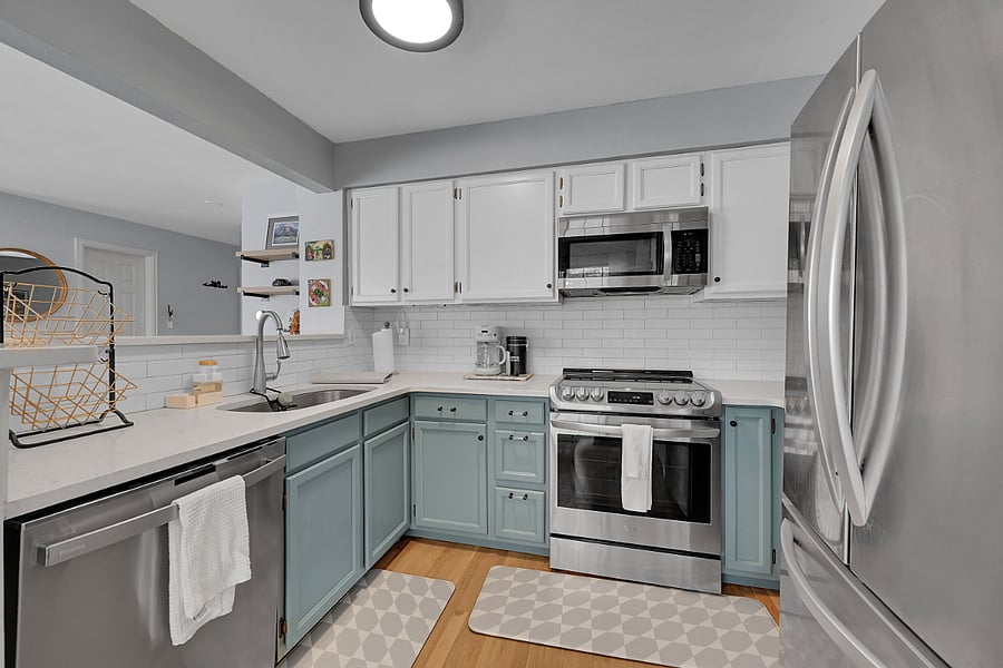 Kitchen with stainless steel appliance, coffee maker, fully stocked