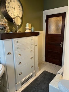 Shared bathroom with ample storage