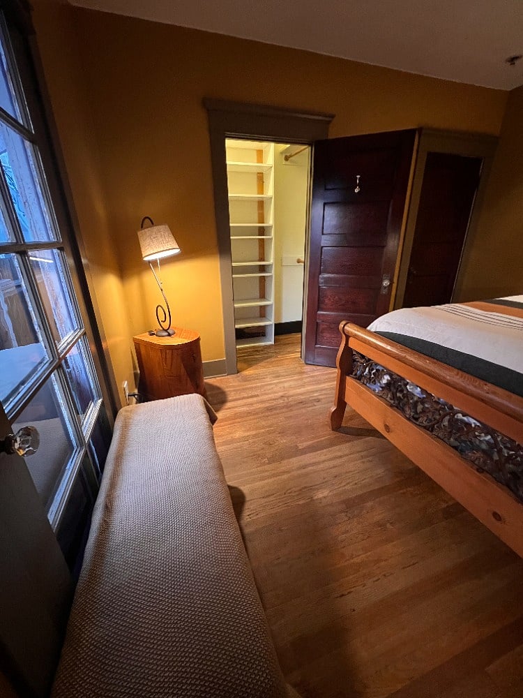 Another view of the bedroom showing the walk-in closet entry