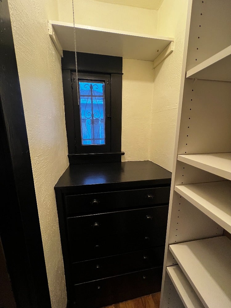 Spacious walk-in closet with plenty of cabinet drawer storage for longer stays