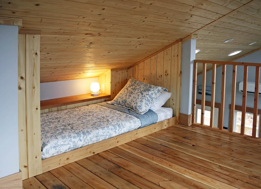 extra sleeping space, with shelf, reading lamp (w USB ports for charging phones), outlet