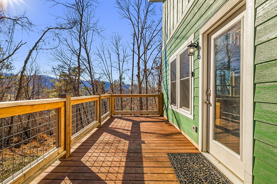 large deck looking on to woods, mountains