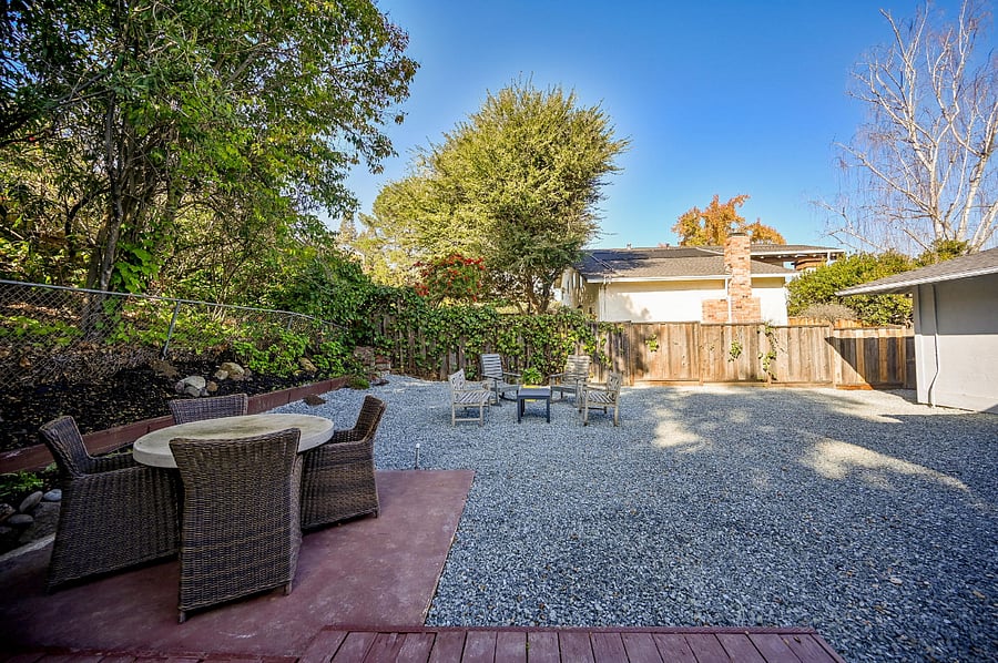 Large backyard with cement top dining table