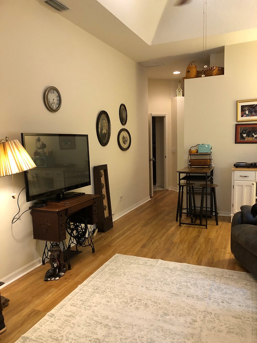 Hall to bathroom from sitting room and little kitchenette and table or workstation.