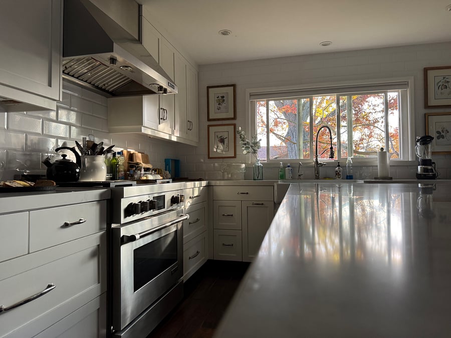 Chefs kitchen includes JenAir hood, gas range, and convection oven. Marble island center piece is a solid design component, both super useful and attractive.