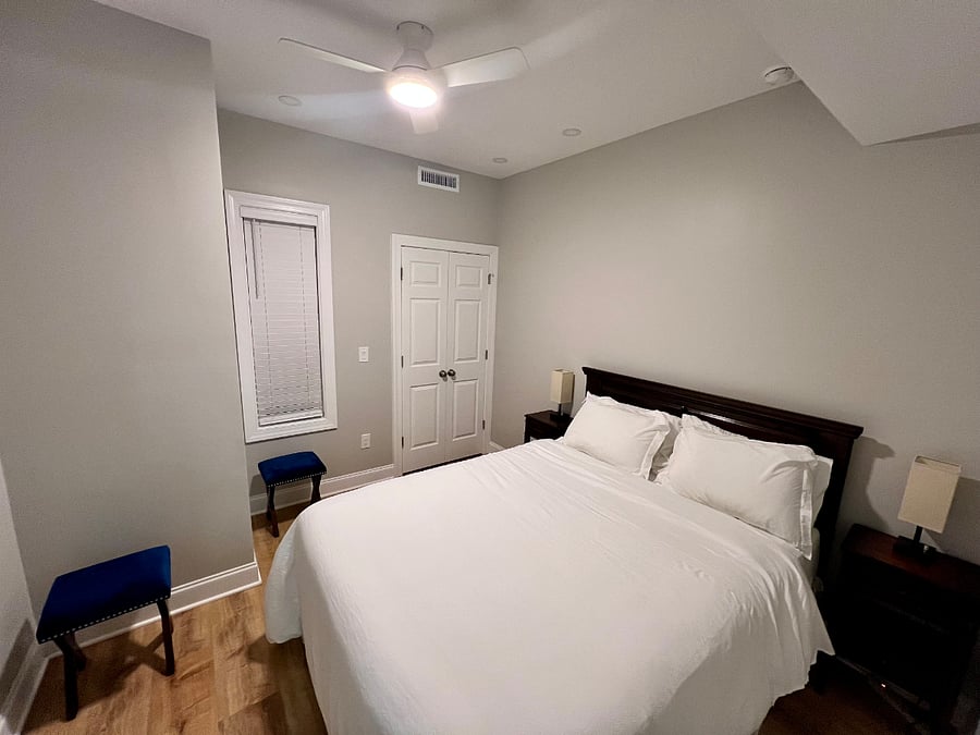 Bedroom with ceiling fan for added comfort