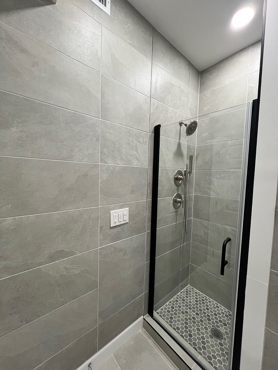 Walk in shower with glass door and upgraded tiles