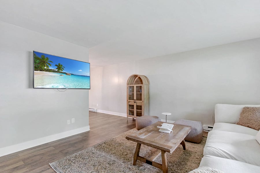 Spacious living room with comfy seating and a smart TVperfect for game day gatherings or movie nights