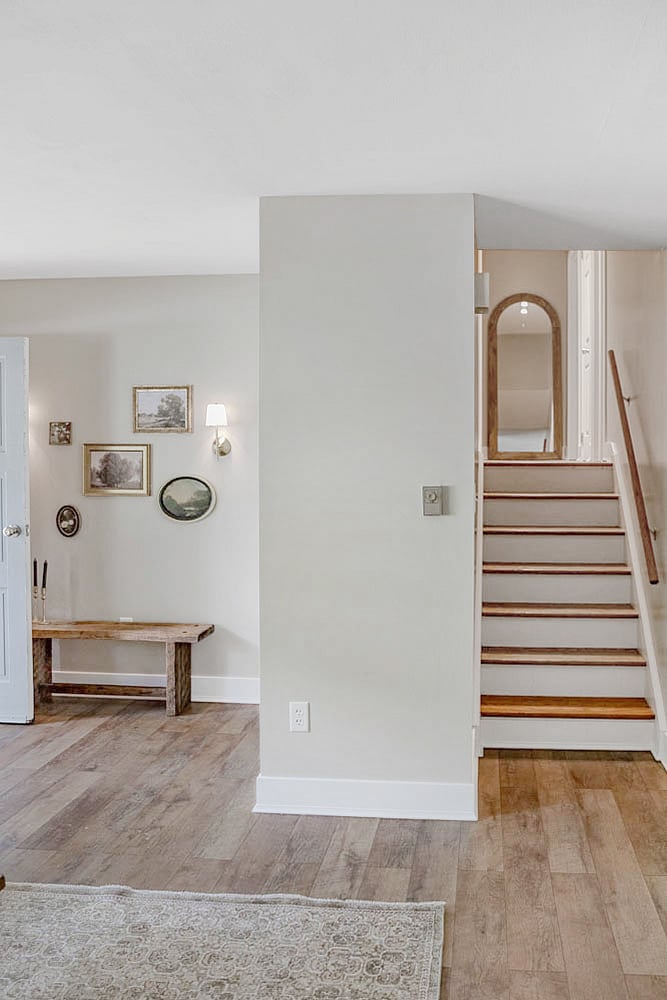 Spacious living room with comfy seating and a smart TV, perfect for game day gatherings or movie nights