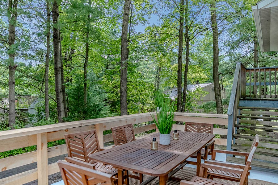 Outdoor Deck
A peaceful, forest-view deck with a wooden dining setperfect for enjoying meals, morning coffee, or relaxing outdoors in a private, natural setting.