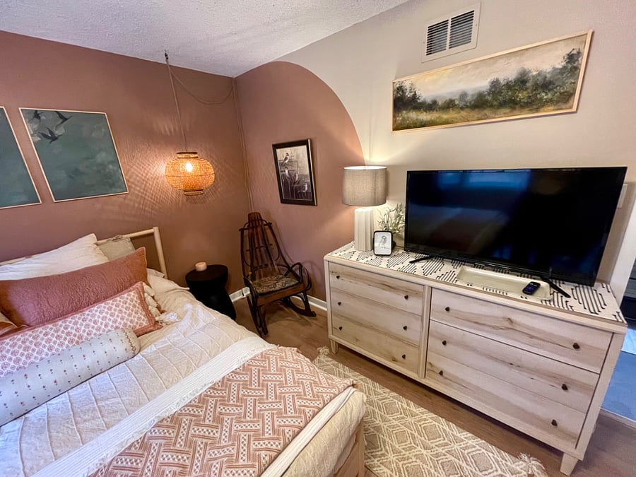 smart tv for viewing from adjacent living area couch in suite