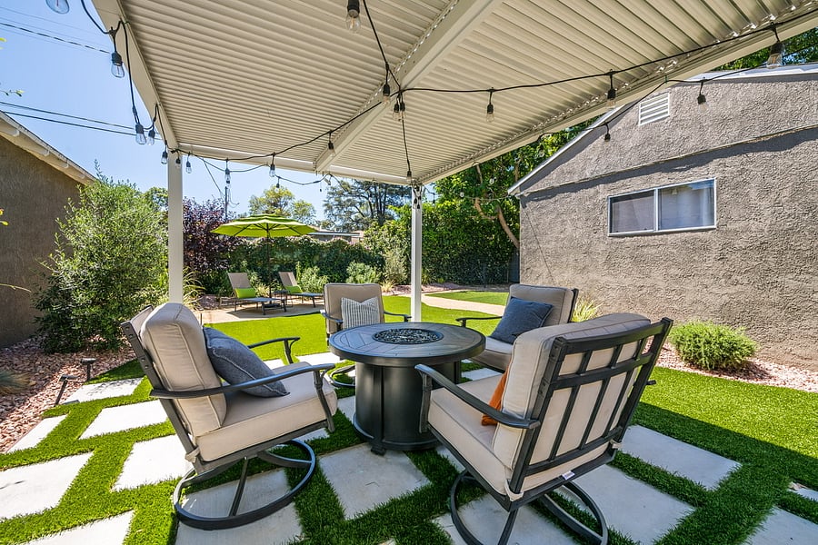 Cozy fire pit under the pergola in the private back yard.