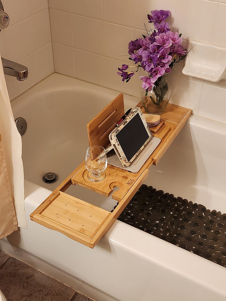 Bathtub with tray for relaxing soaks.