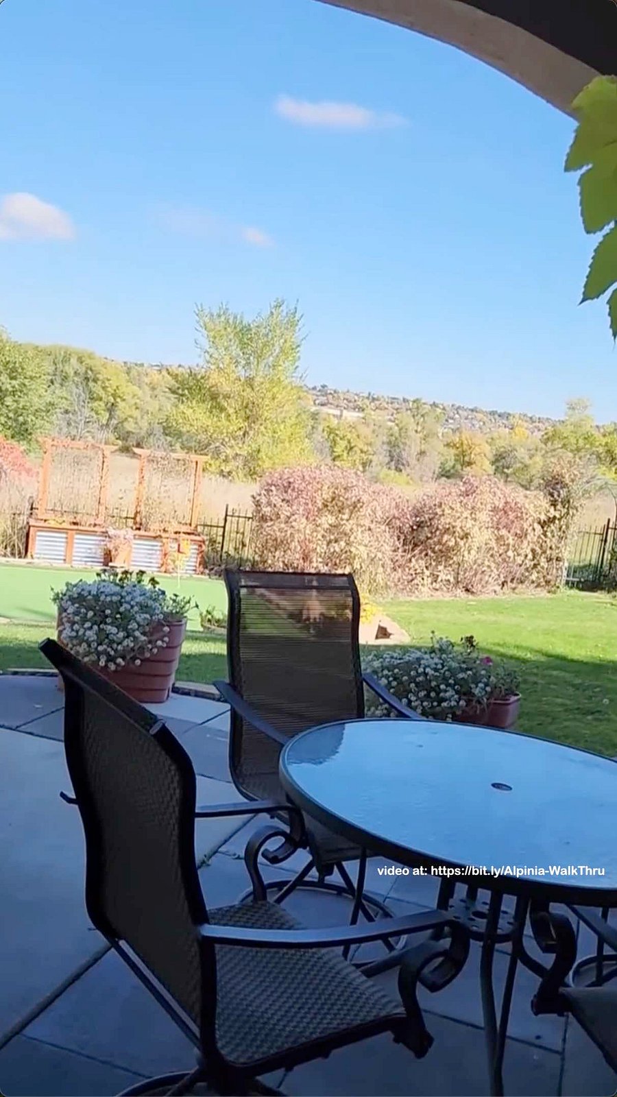 Back patio with seating and access to putting area.