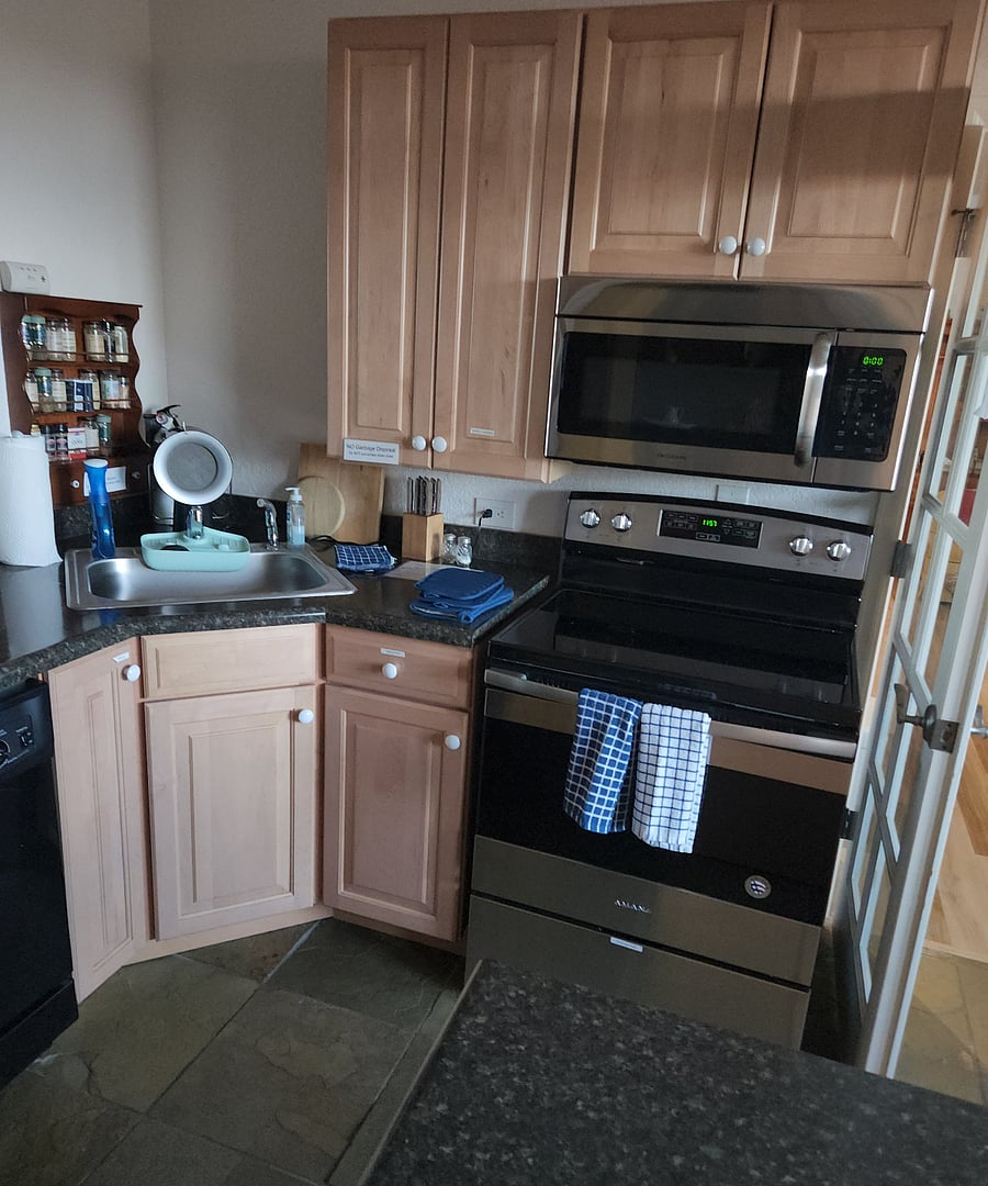 Fully equipped kitchen with island prep counter.