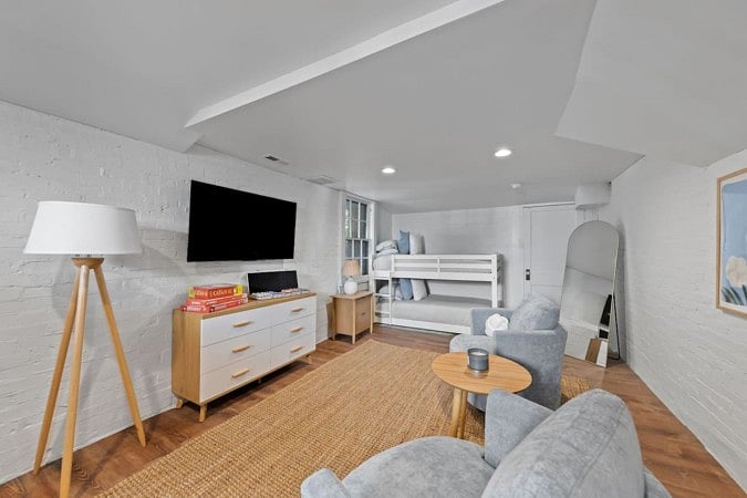 Full sized mirror flat screen tv and cozy sofas