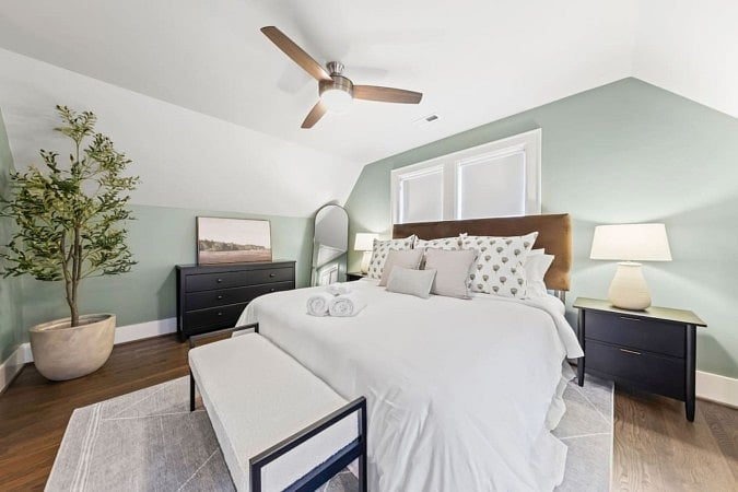 Well-lit and ventilated bedroom with mattress