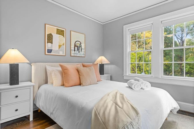 Cozy bed with great green luscious window view