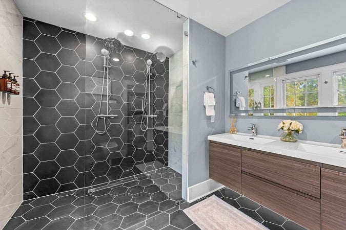 Glass shower area with bathroom counter top