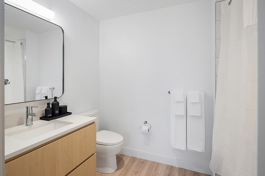 Polished surfaces and warm lighting set a tranquil mood.
Refresh and rejuvenate in this serene bathroom oasis.