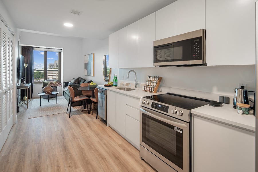 Warm textures and contemporary fixtures define this inviting kitchen.
A refined space that makes cooking feel like a pleasure.